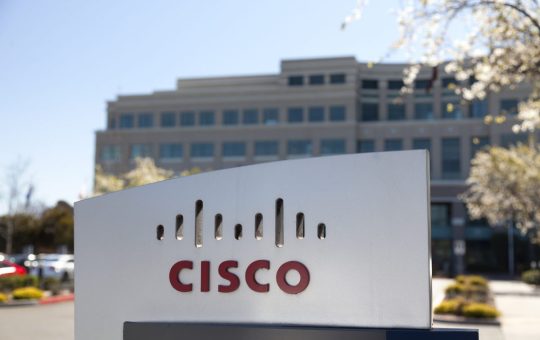 "San Jose, United States - February 11, 2013: A large Cisco Systems sign sits outside their headquarters located at 400 Tasman Dr. in San Jose California. Cisco Systems is a multinational company that produces computer networking equipment."